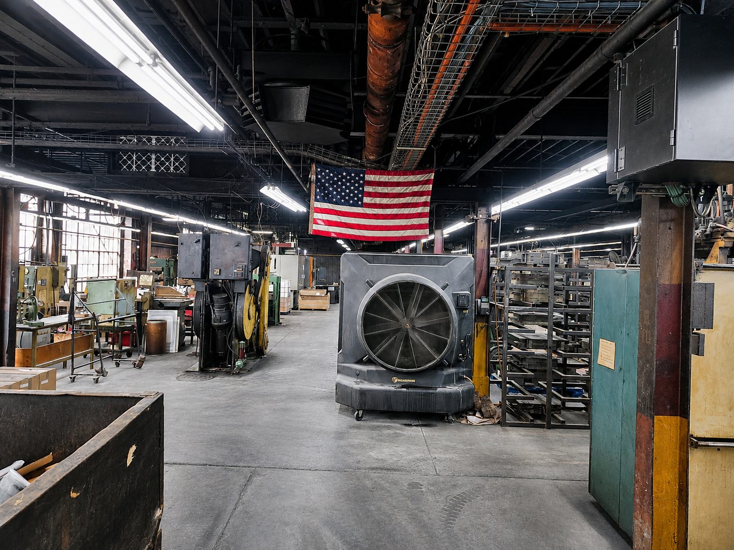 American flag over the Corry Rubber molding floor, US manufacturing